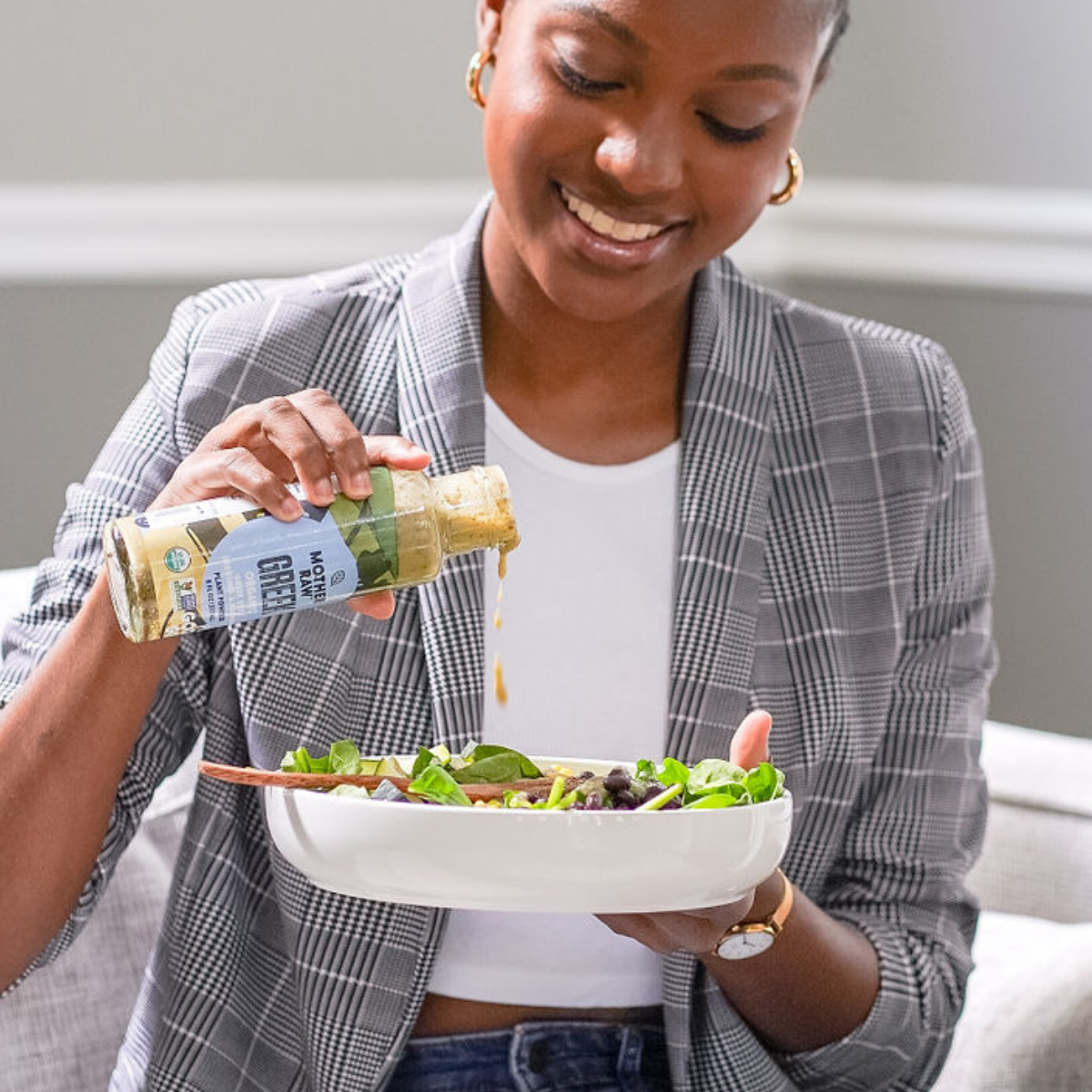 Mother Raw Vegan Greek Dressing being poured onto salad