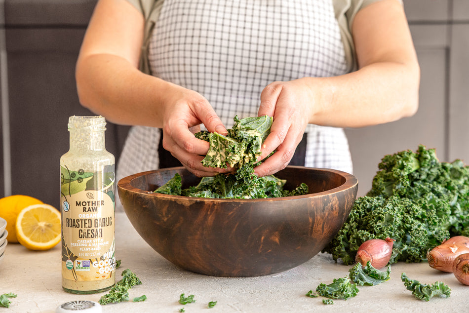 Tossing Kale Salad with Mother Raw Vegan Dairy-Free Ceasar Dressing
