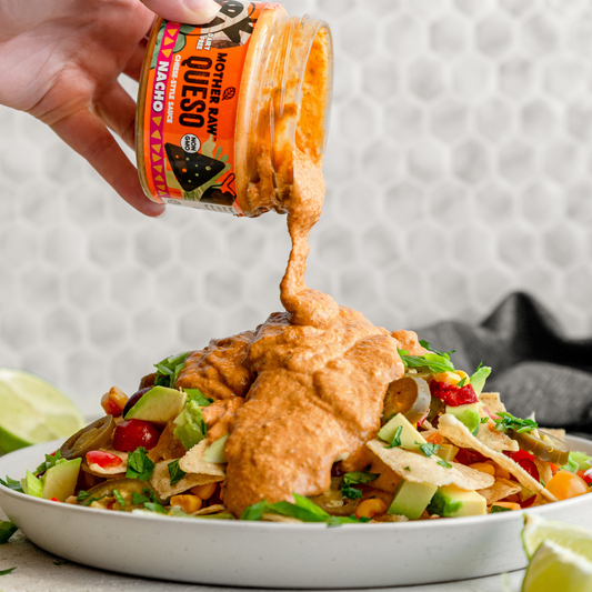 Mother Raw Dairy Free Nacho Queso  Dip over nachos