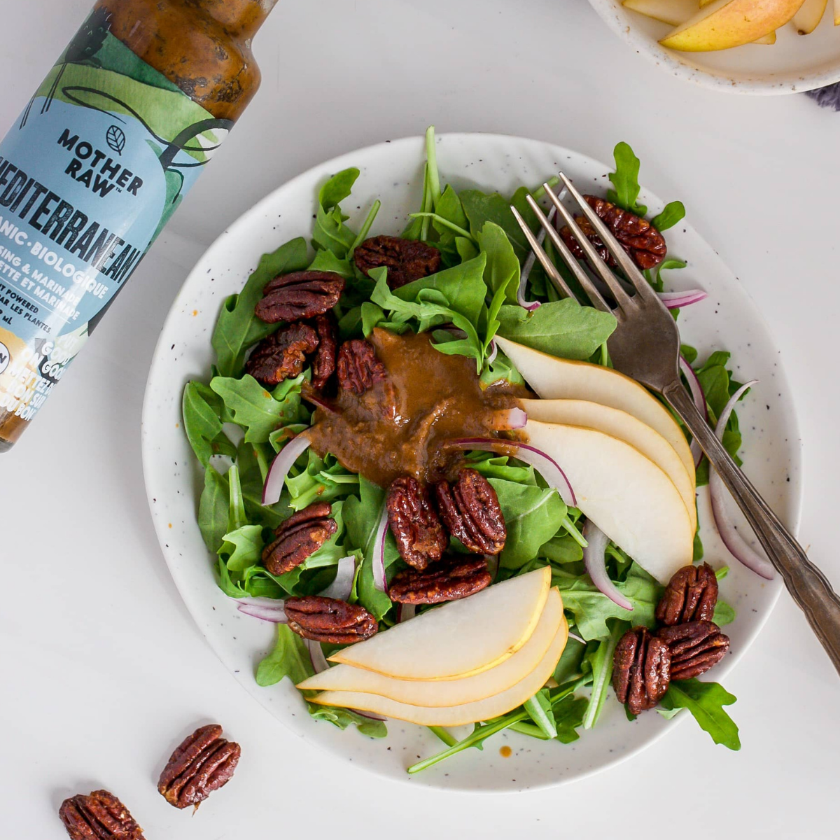 Mother Raw Vegan Mediterranean Dressing  on a salds with pears, spinach and pecans